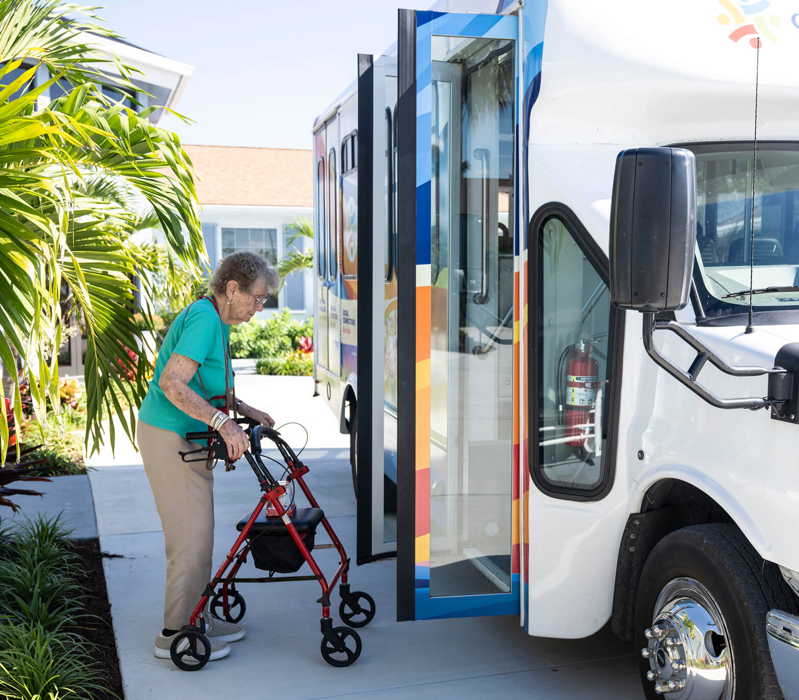 Elderly getting on the bus